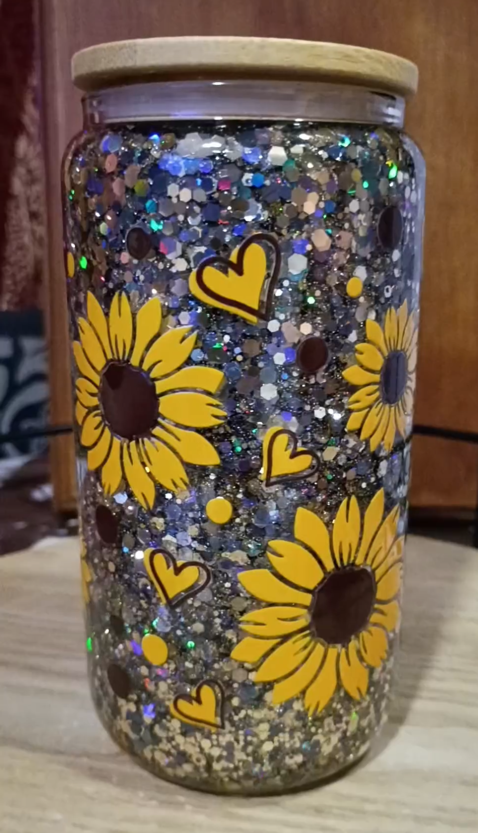 Custom Sunflower Glitter Snow Globe Tumbler with silver holographic glitter, sunflowers, hearts, and bamboo lid