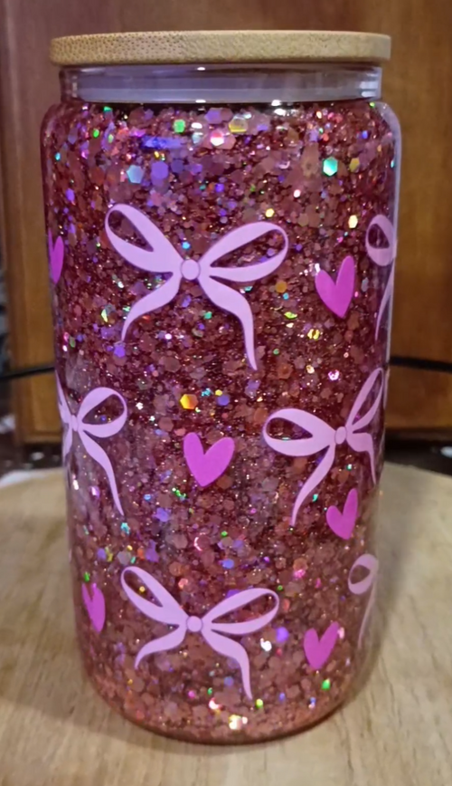 Custom Coquette Glitter Snow Globe Tumbler with pink glitter, bows, hearts, and bamboo lid