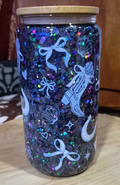 Custom Western Cowgirl Glitter Snow Globe Tumbler with navy holographic glitter, cowboy boots, bows, and bamboo lid